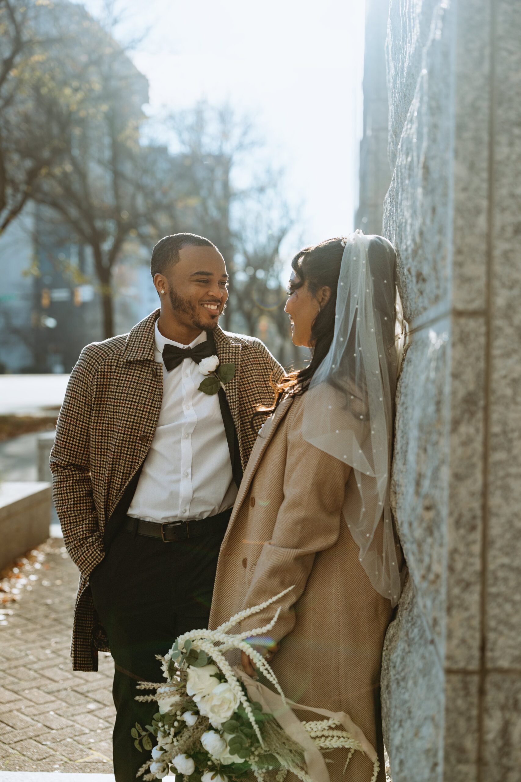 Bride and groom embracing outside the Charlotte courthouse after their intimate civil elopement ceremony.
